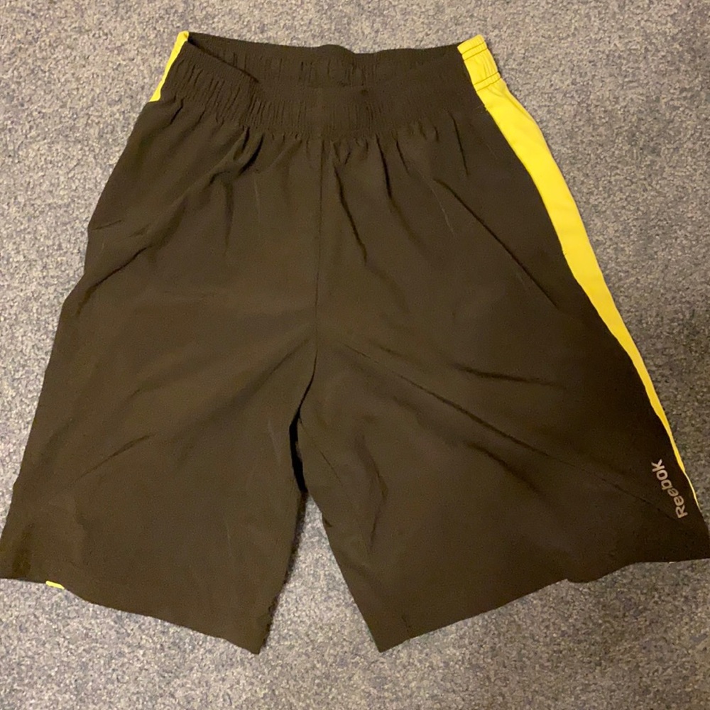 Black quick dry athletic shorts with pockets.